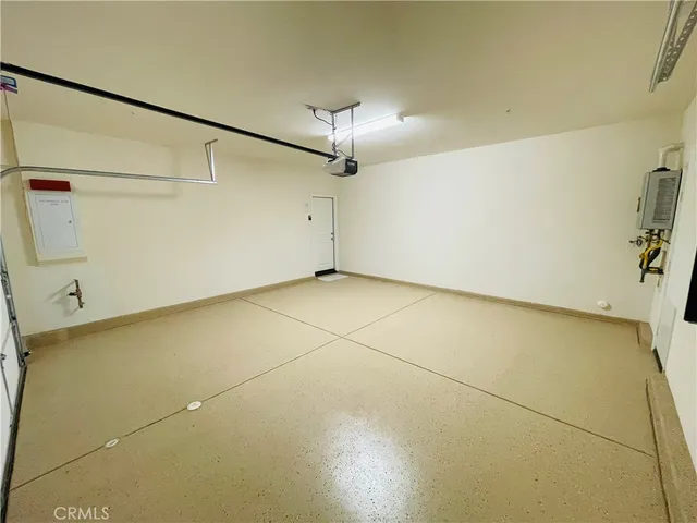 a view of an house with backyard space and balcony