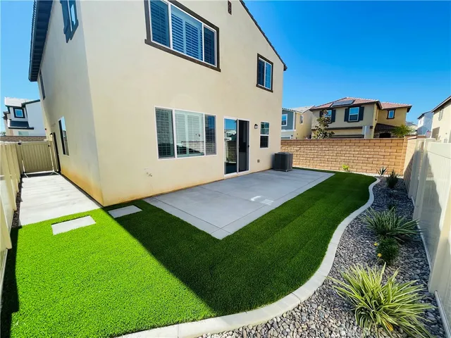 a view of a house with swimming pool having outdoor seating