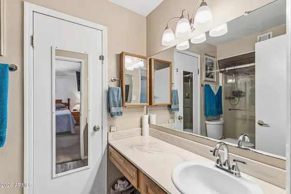 a room with furniture pool table and wooden floor
