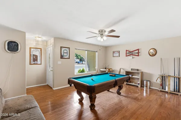 a view of a swimming pool with outdoor seating and plants