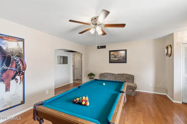 a view of a swimming pool with a patio