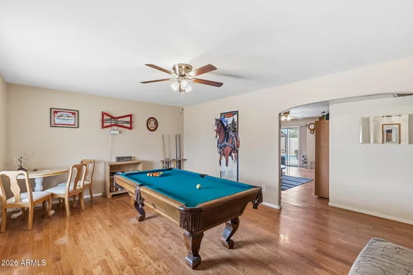 a swimming pool with outdoor seating and yard