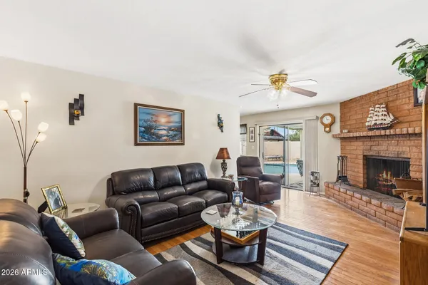 a living room with furniture and a fireplace