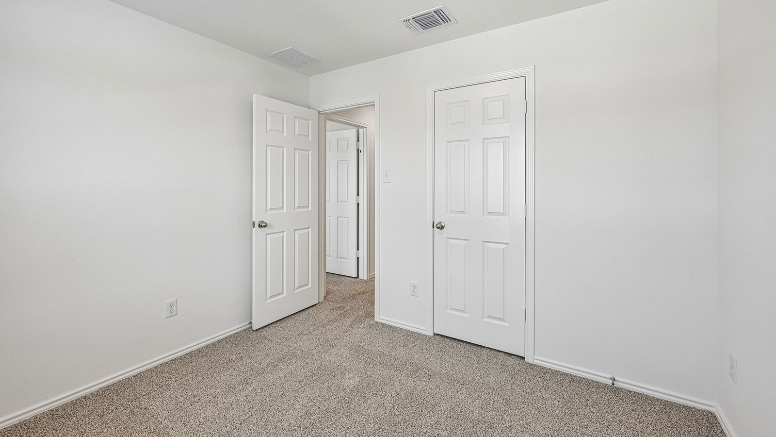 369 Old Stage Coach Road Jarrell, TX 76537 - Photo 18 of 25 Plush carpeting and crisp white trim enhance this versatile bedroom space.
