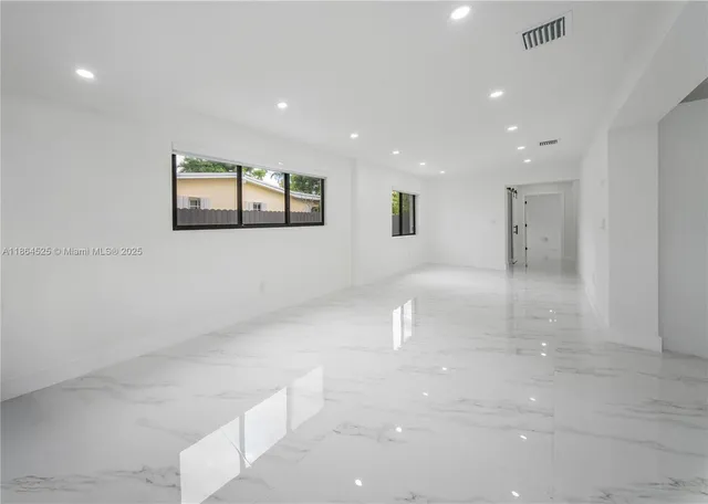 a view of kitchen and windows