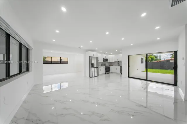 a view of a hallway with a living room