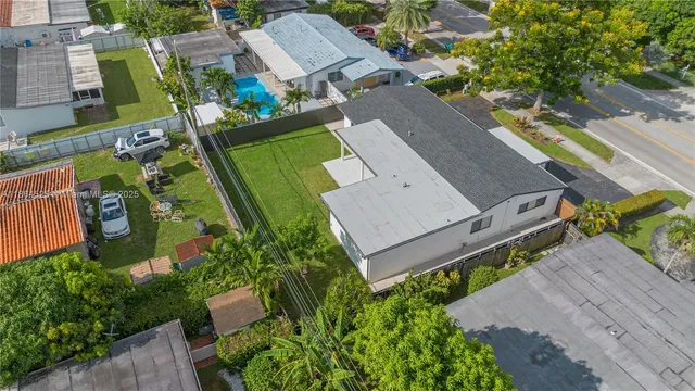 an aerial view of a house with a garden