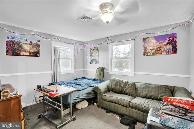 a living room with furniture a table and a window