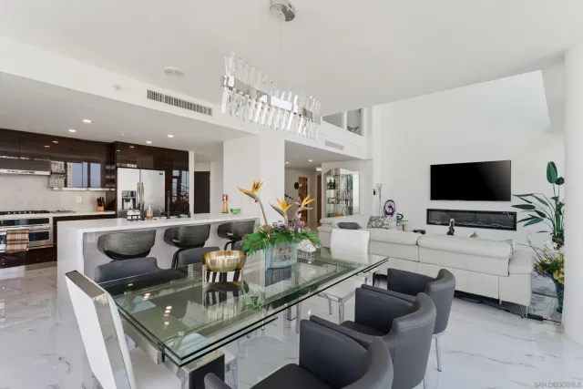 a large kitchen with a table and chairs