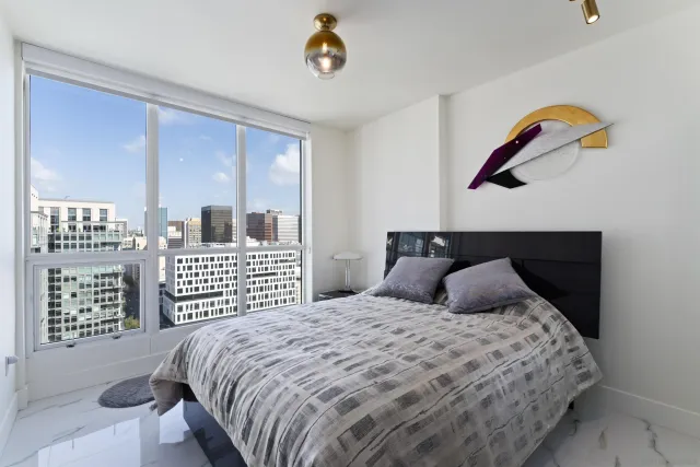 a bathroom with a sink vanity mirror and toilet