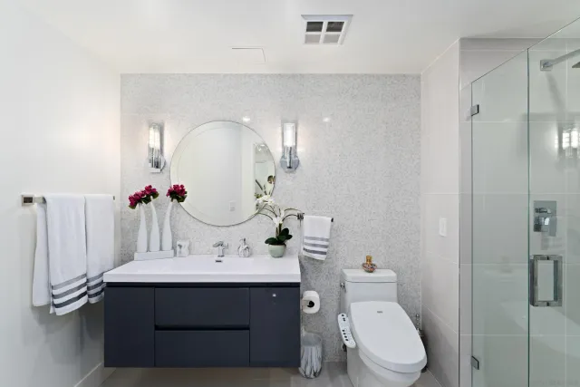 a living room with furniture a flat screen tv and a large window