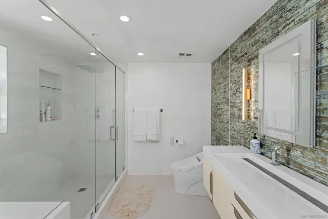 a view of roof deck with seating space and wooden floor