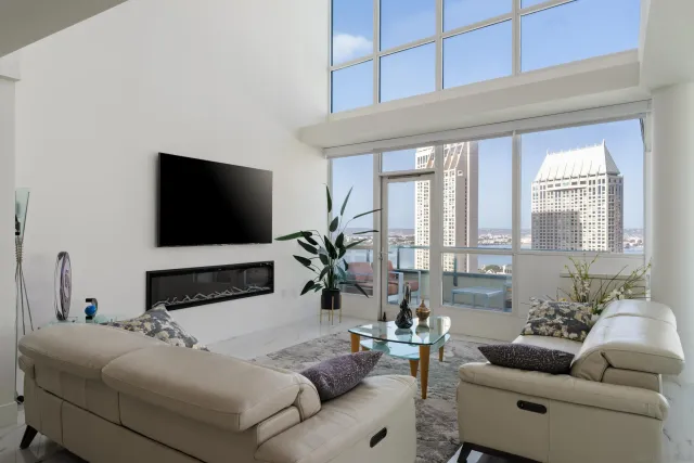 a living room with furniture and a flat screen tv