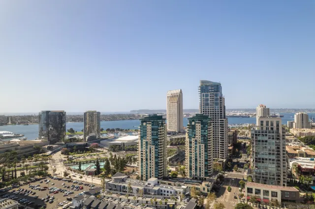 a bedroom with a large bed and a large window