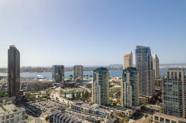 a balcony with furniture and city view