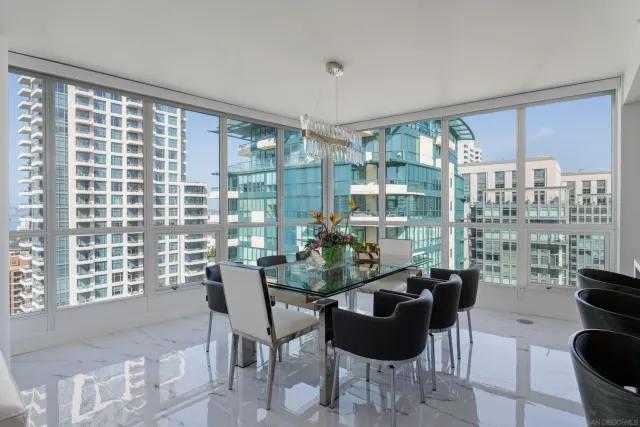 a living room with couches a coffee table and chairs
