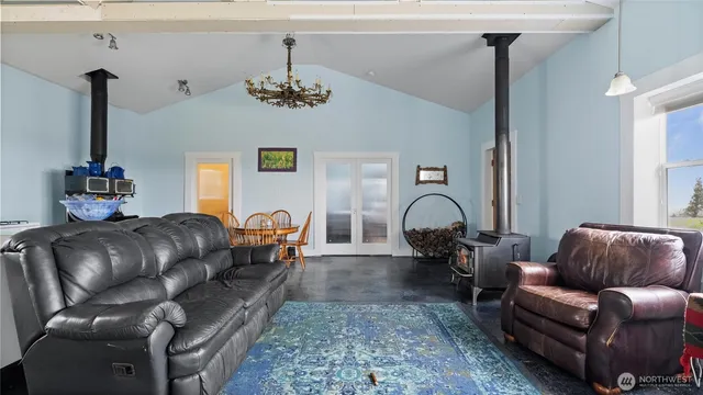 a living room with furniture flowerpot and window