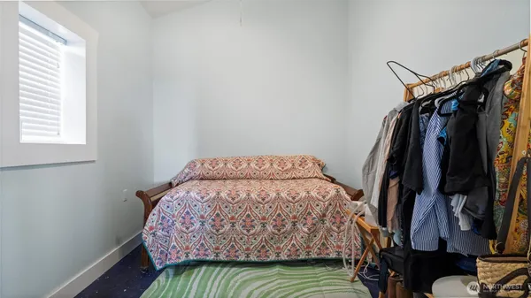 a bedroom with a bed and a closet
