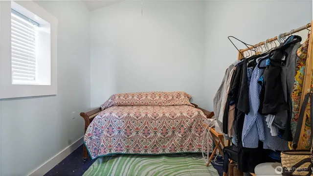 a bedroom with a bed and a closet