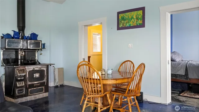 a view of a dining room with furniture and window