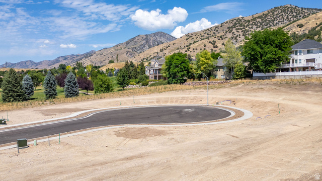 1473 Red Fox Court, Unit 4 Logan, UT 84321 - Photo 16 of 19 Cleared building lot featuring a paved cul-de-sac, curb, and visible utility connections