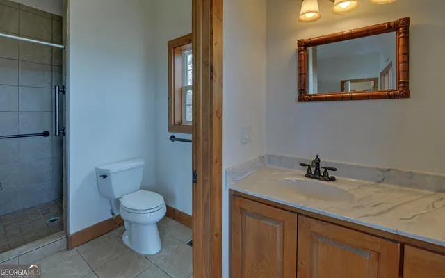 a view of balcony with wooden floor and fence