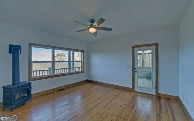 a view of a balcony with wooden floor