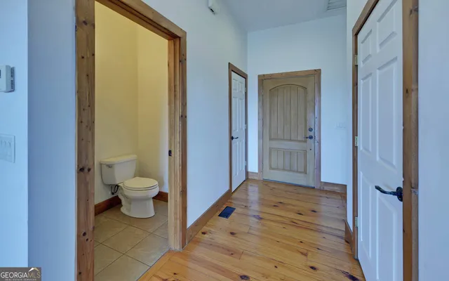 a living room with furniture large window and a flat screen tv