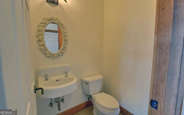 a view of room with window and wooden floor