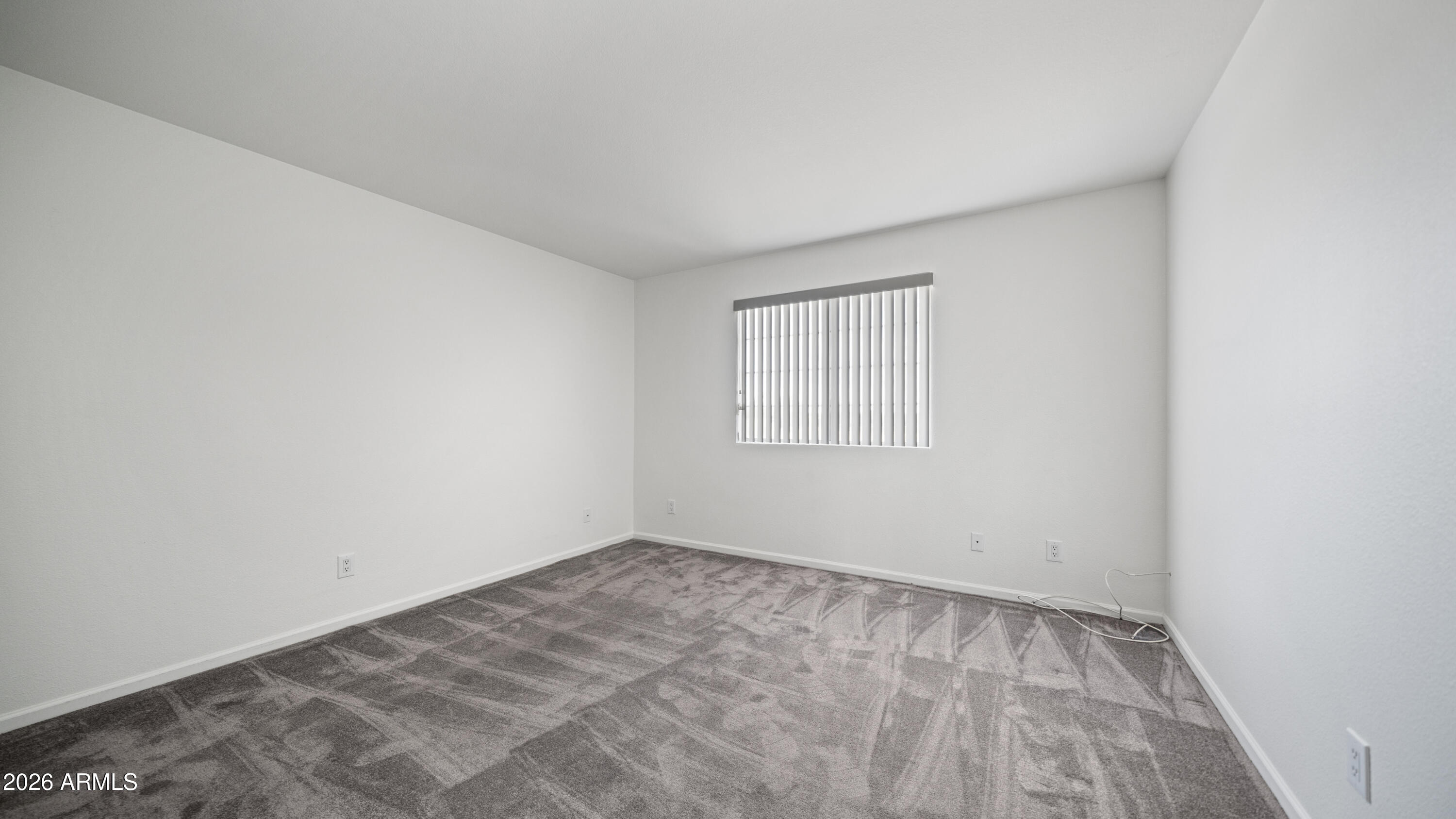 6620 West Redfield Road Glendale, AZ 85306 - Photo 27 of 33 an empty room with a window