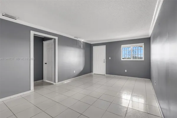 a view of an empty room and window