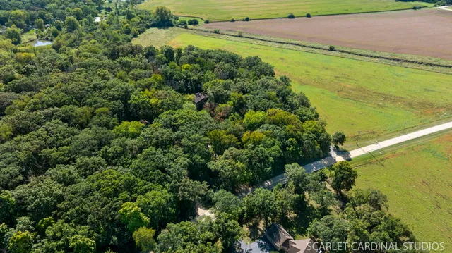 a view of a field with an ocean view