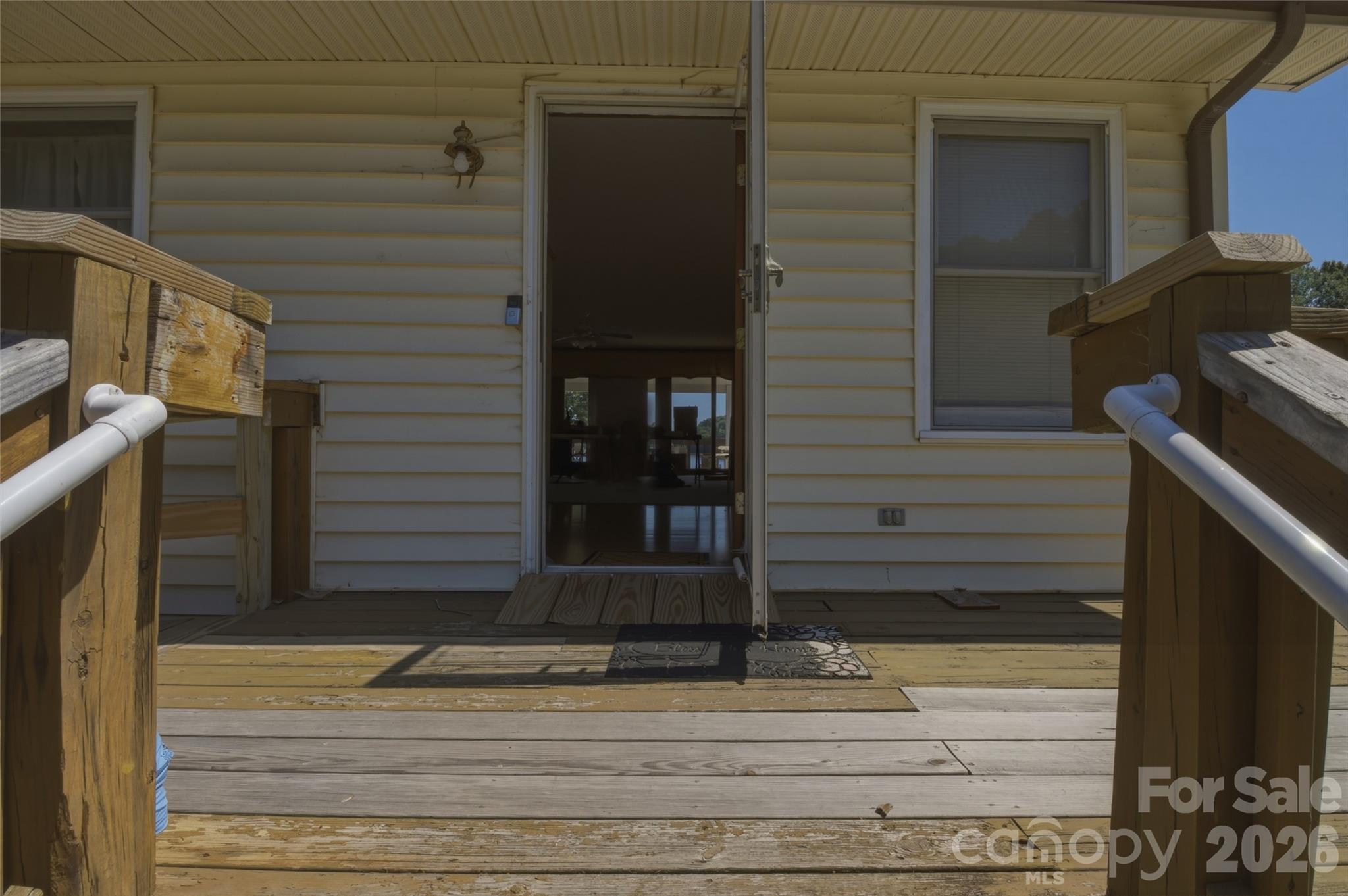 8226 Normandy Road Denver, NC 28037 - Photo 16 of 29 a view of a house with a door