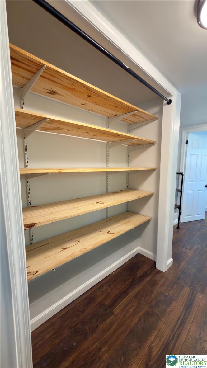 246 Poplar Street Bath, PA 18014 - Photo 24 of 34 Adjustable wooden shelving and a clothing rod offer ample storage within this practical closet space.