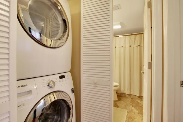 a view of a hallway with washer and dryer