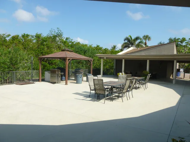 a view of a lake with wooden floor and bridge