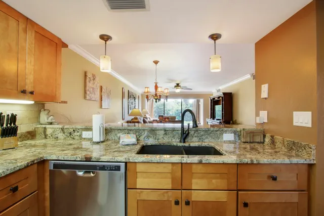 a kitchen with counter top space and sink