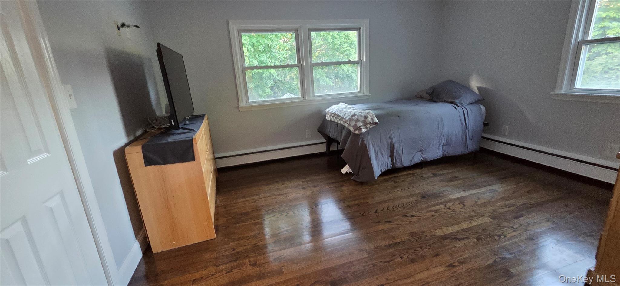 522 Moriches Road St. James, NY 11780 - Photo 23 of 49 a bed sitting in a room next to a window