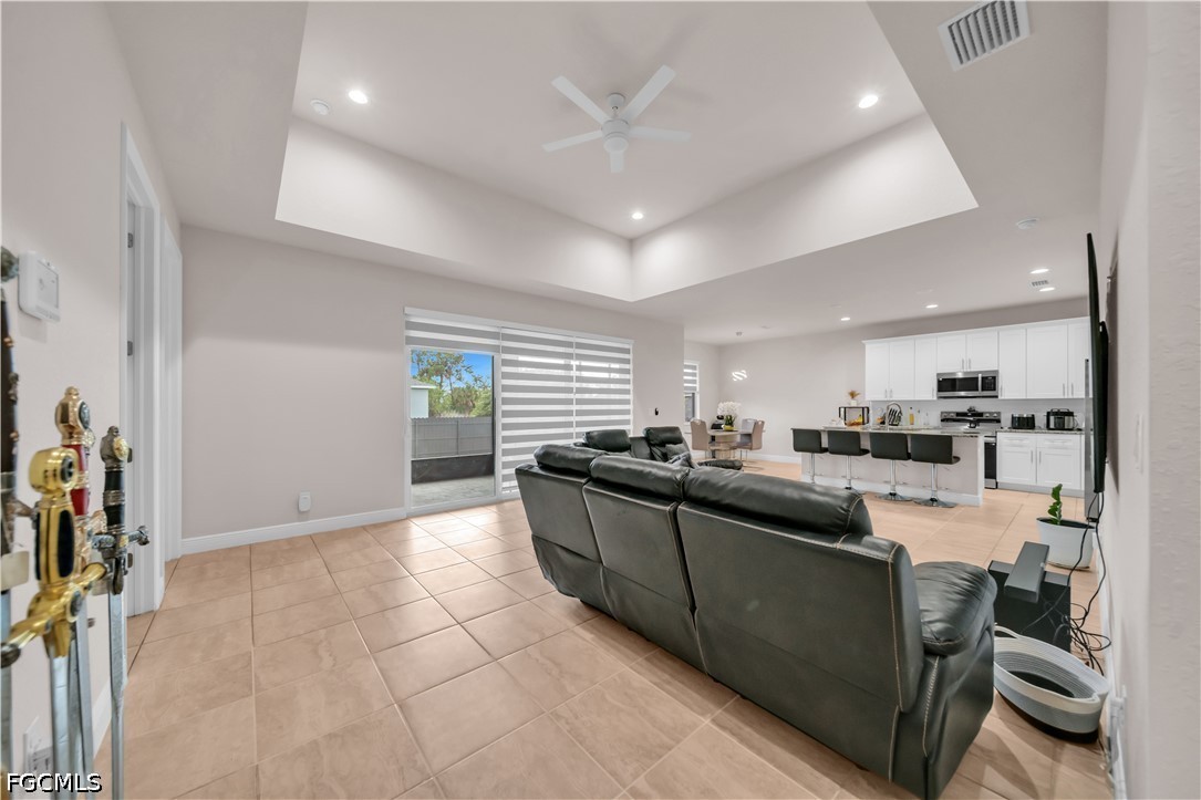 384 Neighborly Road LaBelle, FL 33935 - Photo 10 of 45 a kitchen with stainless steel appliances granite countertop a sink and cabinets