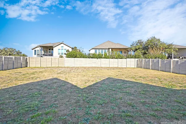 a house with swimming pool in front of it