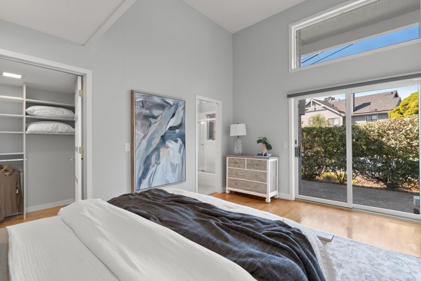 152 Frederick Street Santa Cruz, CA 95062 - Photo 18 of 64 a bedroom with a bed and a large window