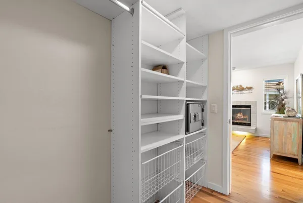 a living room with furniture a fireplace and a ceiling fan