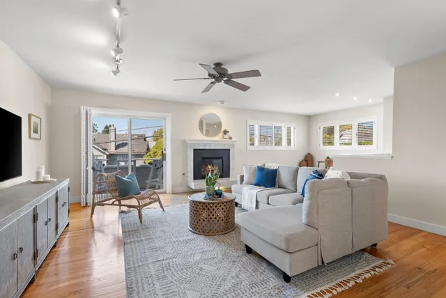 a view of a balcony with chairs and table