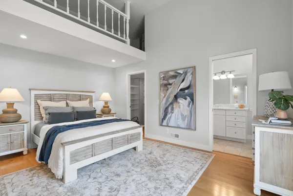 a bedroom with a bed and a view of bathroom