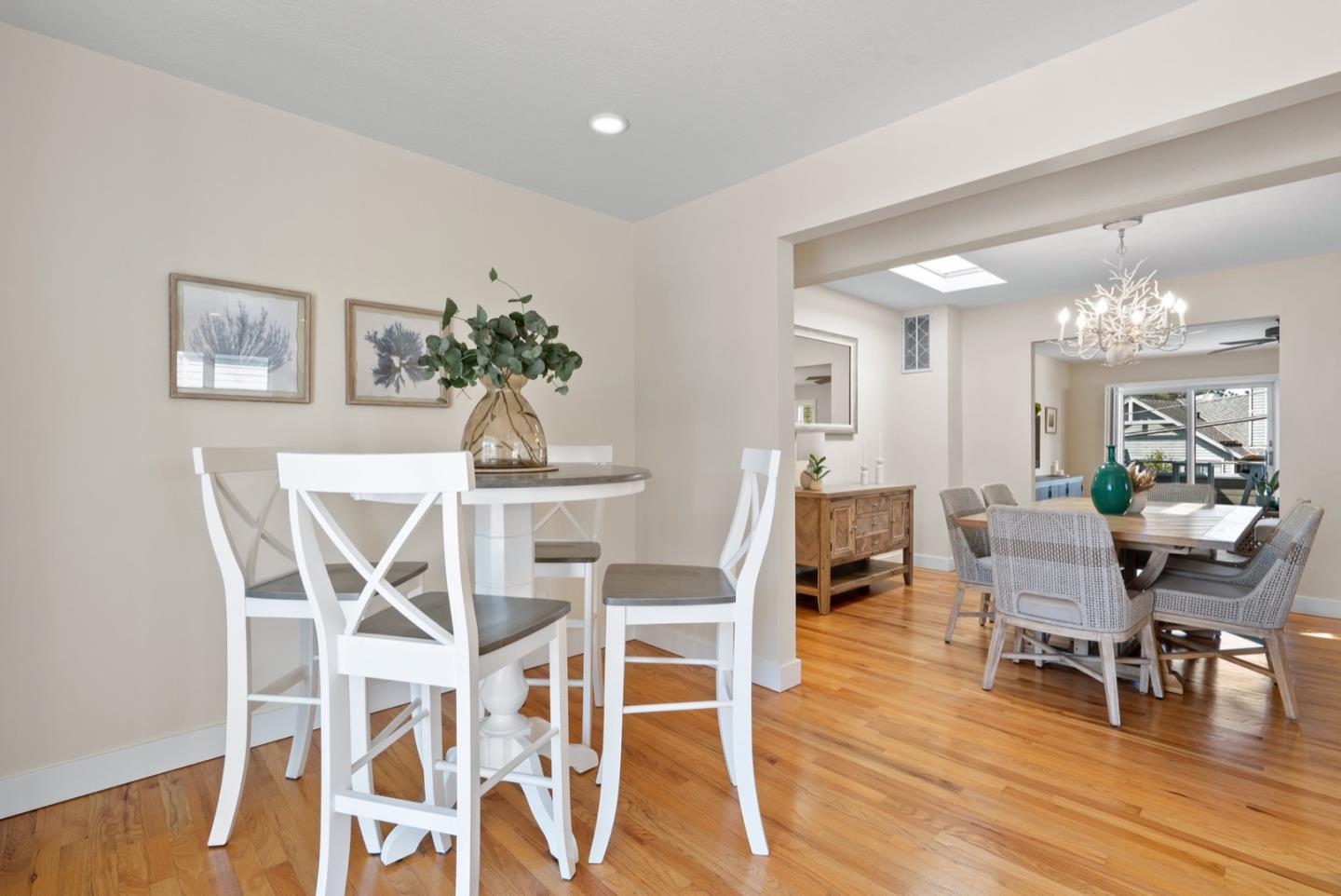 152 Frederick Street Santa Cruz, CA 95062 - Photo 41 of 64 a dining room with furniture a chandelier and wooden floor