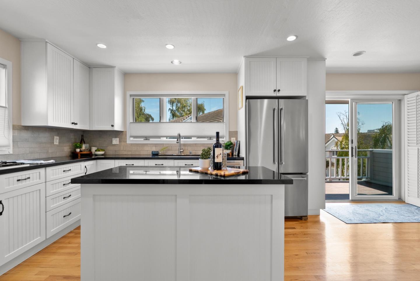 152 Frederick Street Santa Cruz, CA 95062 - Photo 43 of 64 a kitchen with stainless steel appliances granite countertop a refrigerator and a sink
