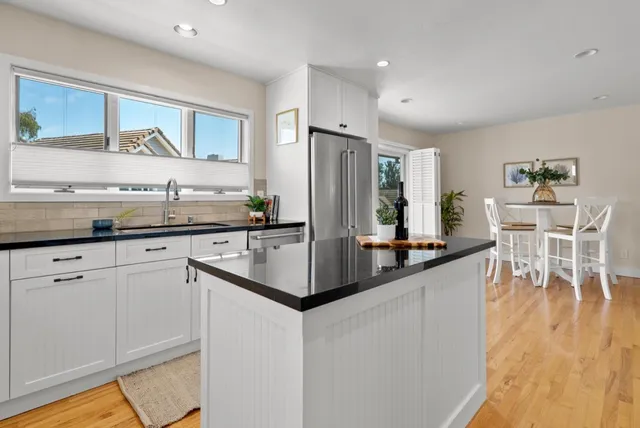 a view of balcony with wooden floor and fence