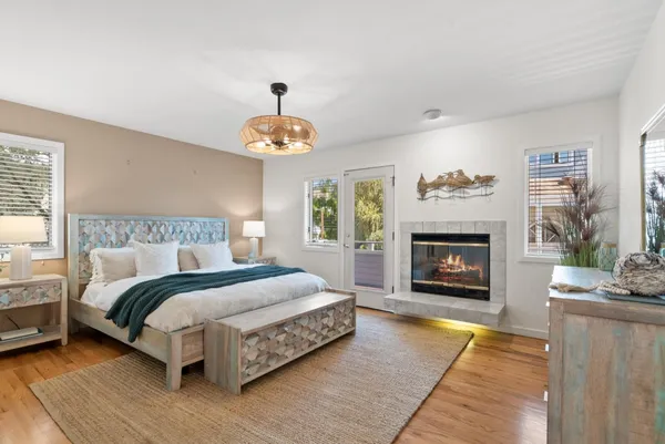 a spacious bedroom with a bed and a fireplace