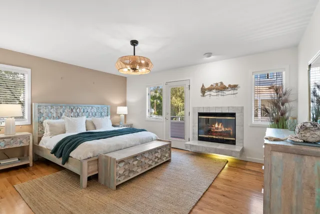 a spacious bedroom with a bed and a fireplace