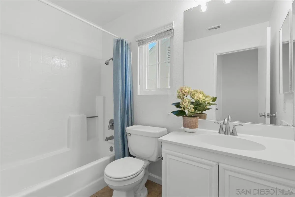 8973 Arlingdale Way Spring Valley, CA 91977 - Photo 11 of 24 a bathroom with a sink toilet and shower